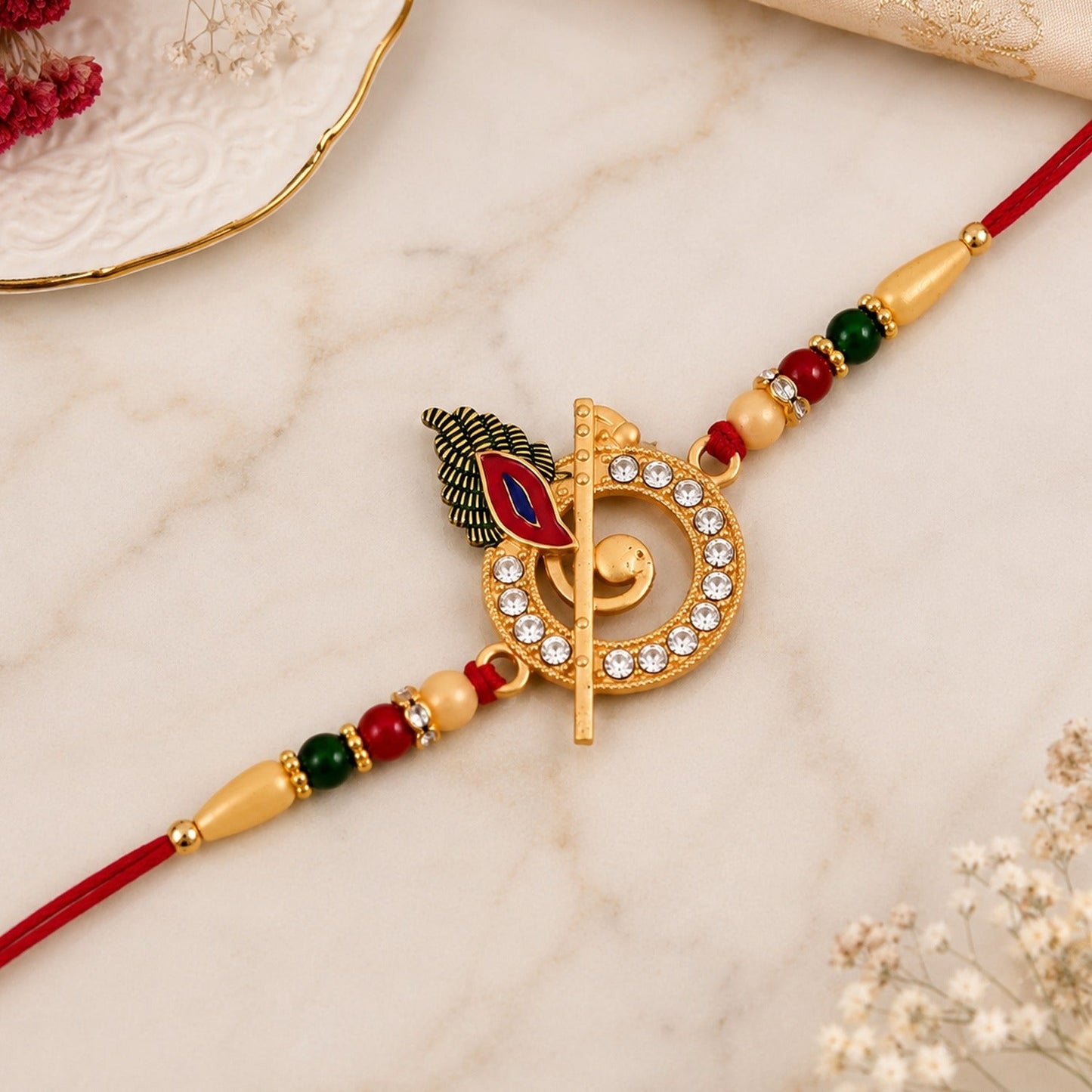 Krishna Flute Rakhi showcasing stone-studded peacock feather design for Raksha Bandhan