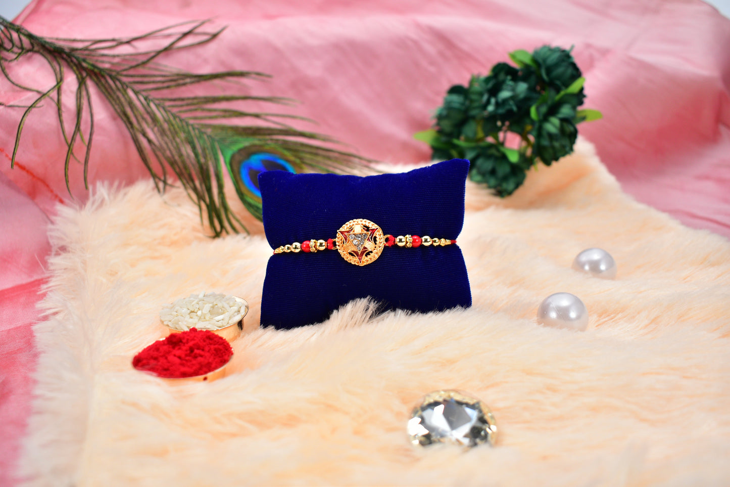 Close-up of the intricate gold-plated round Rakhi for brother