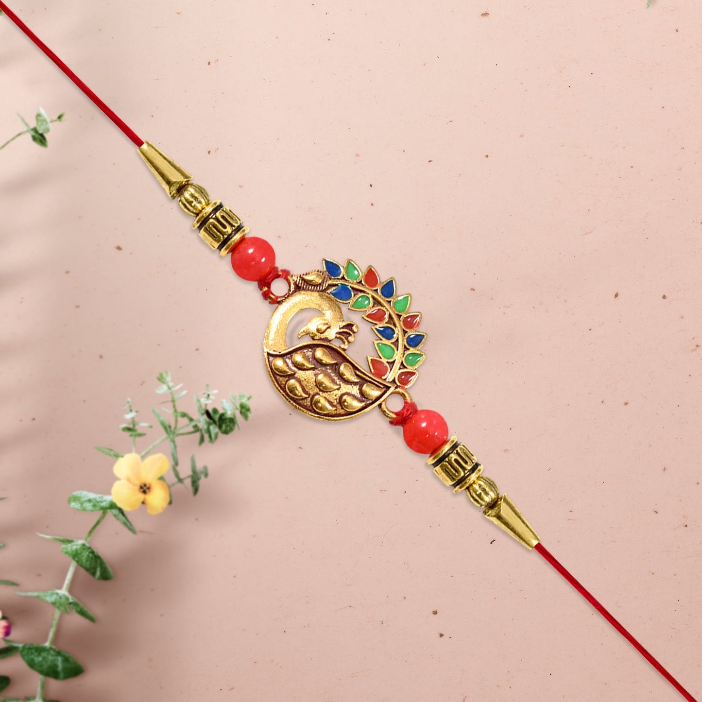 Side view of designer peacock rakhi highlighting elegant craftsmanship