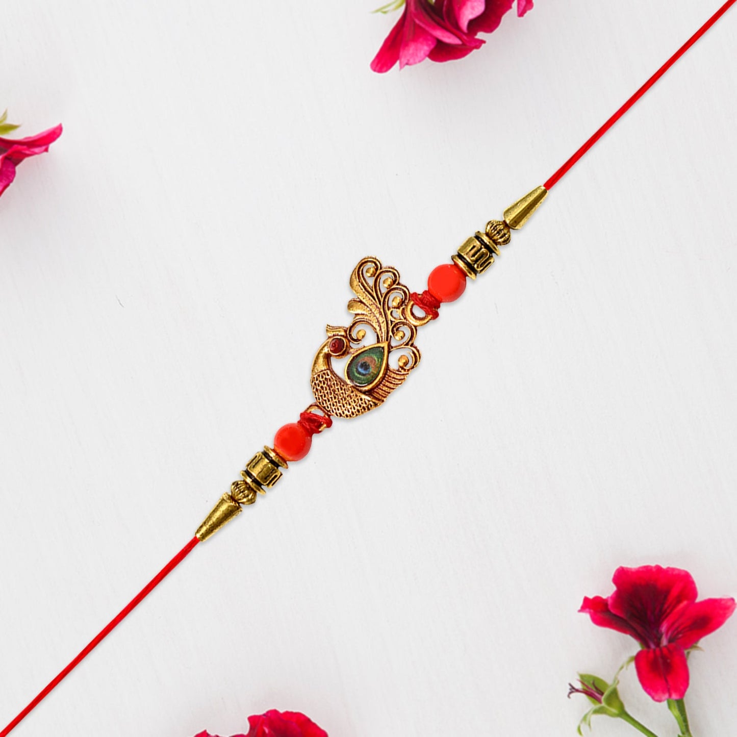 Detailed view showing intricate golden stone and bead work on Peacock Rakhi