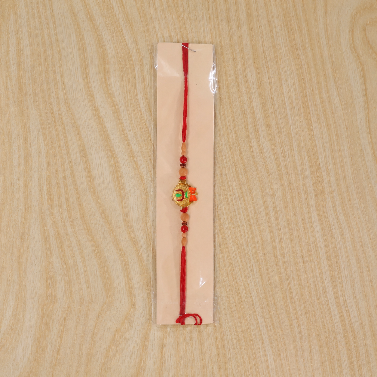 Assorted designer rakhi collection with green stone centerpiece