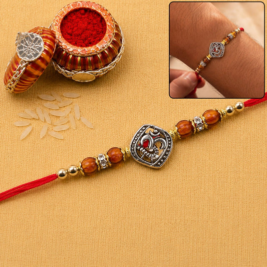 Close-up of the spiritual Om Rakhi with beads, ready for Rakshabandhan.
