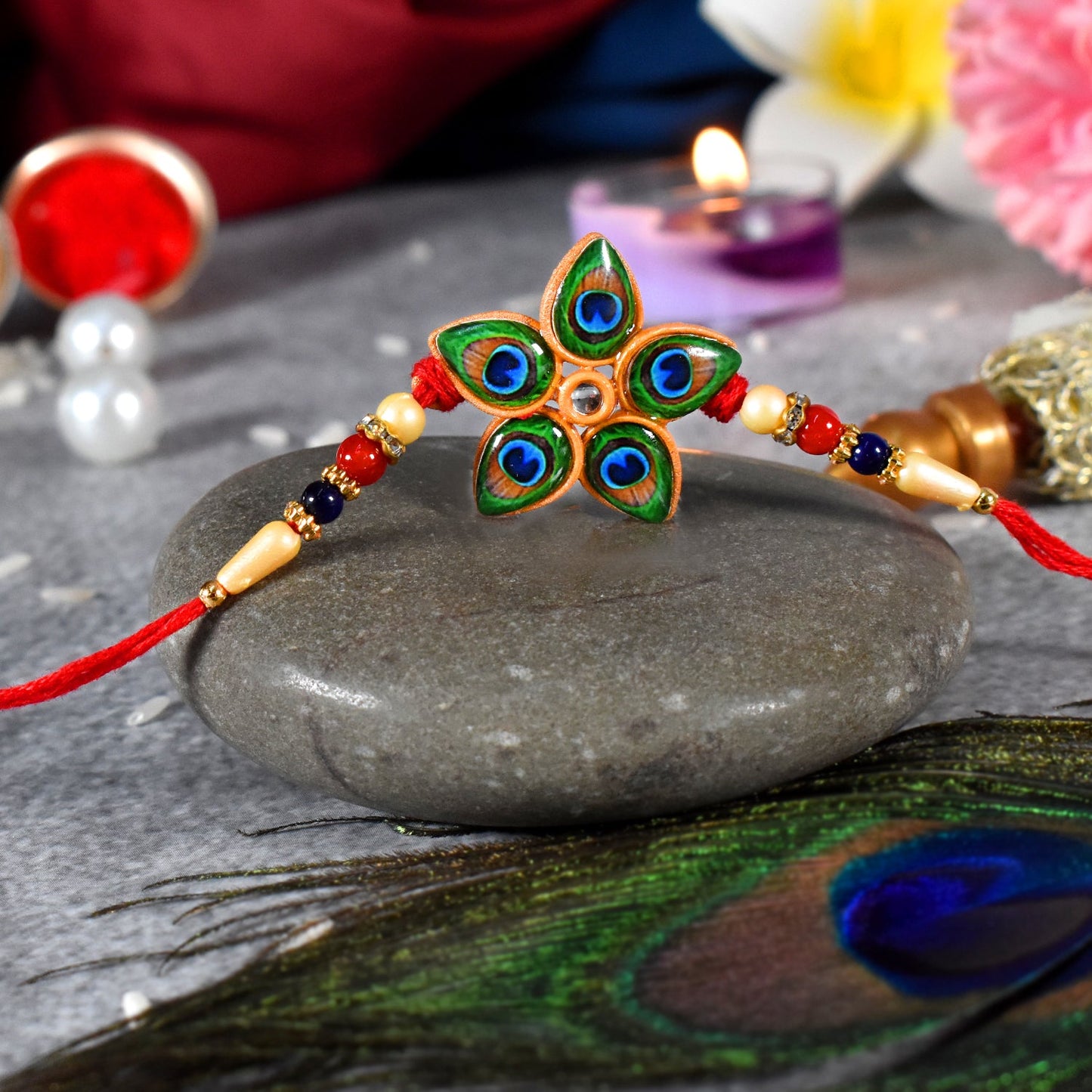 Close-up of Mor Pankh Rakhi with star shape and peacock feather theme