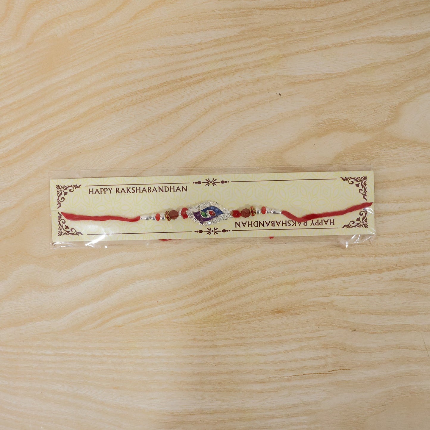Festive rakhi with elegant design, beads, and thread for Raksha Bandhan
