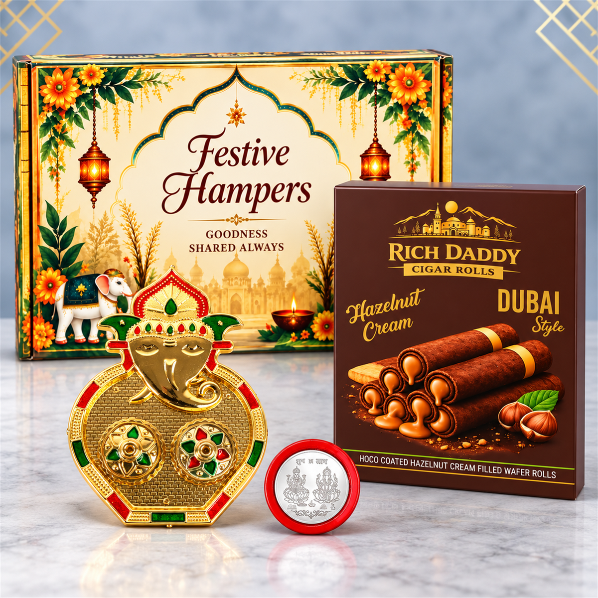 A gold Ganesh kumkum dish, a box of hazelnut wafer rolls, and a silver coin, arranged in front of a decorative festive