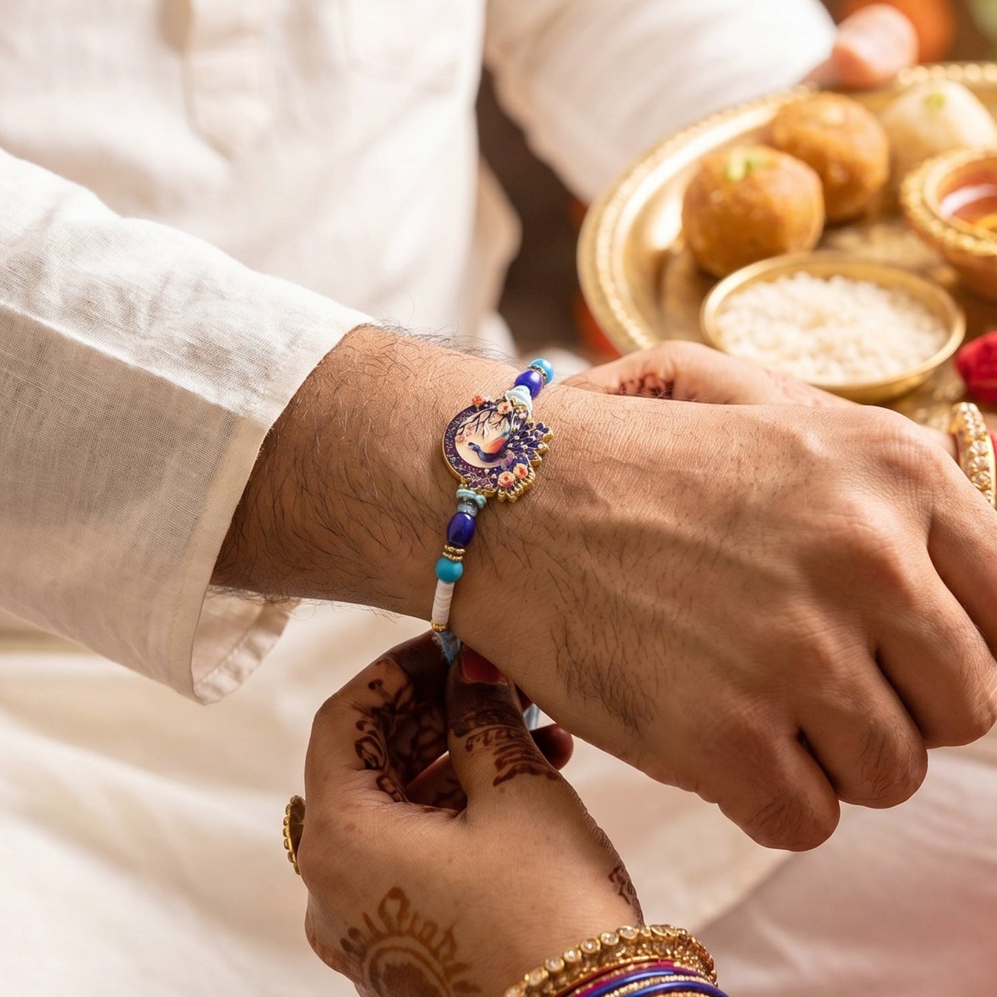 Close-up of peacock centerpiece on traditional designer Rakhi