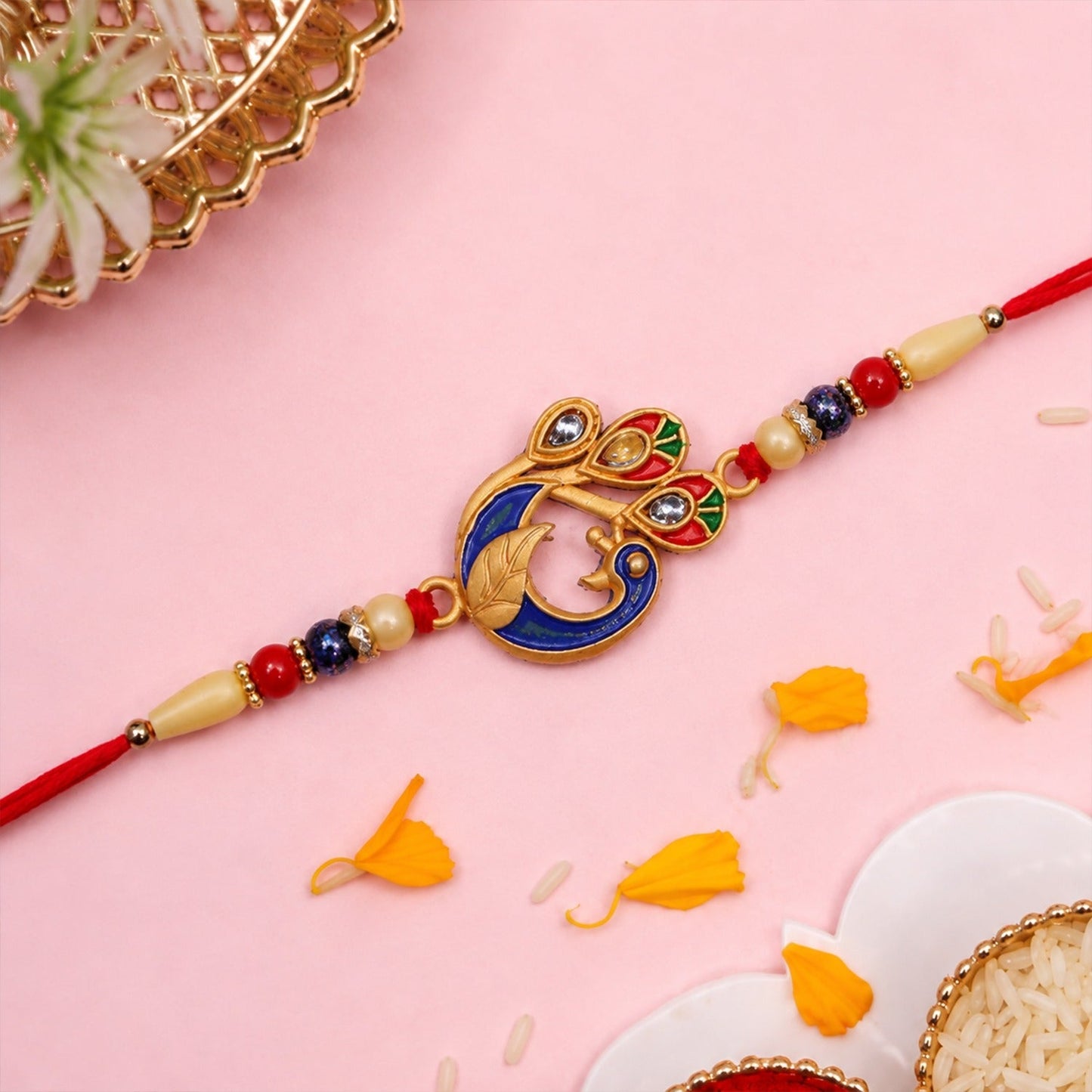 Vibrant Peacock Meenakari Rakhi with intricate design and comfortable beaded thread.