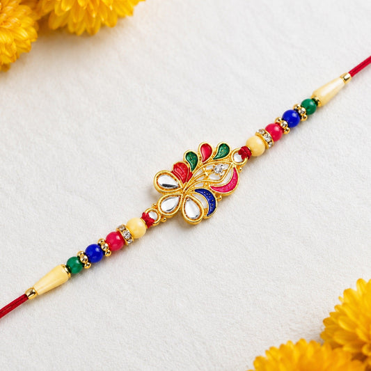 Peacock Feather Rakhi featuring vibrant multicolor beads on a traditional background.