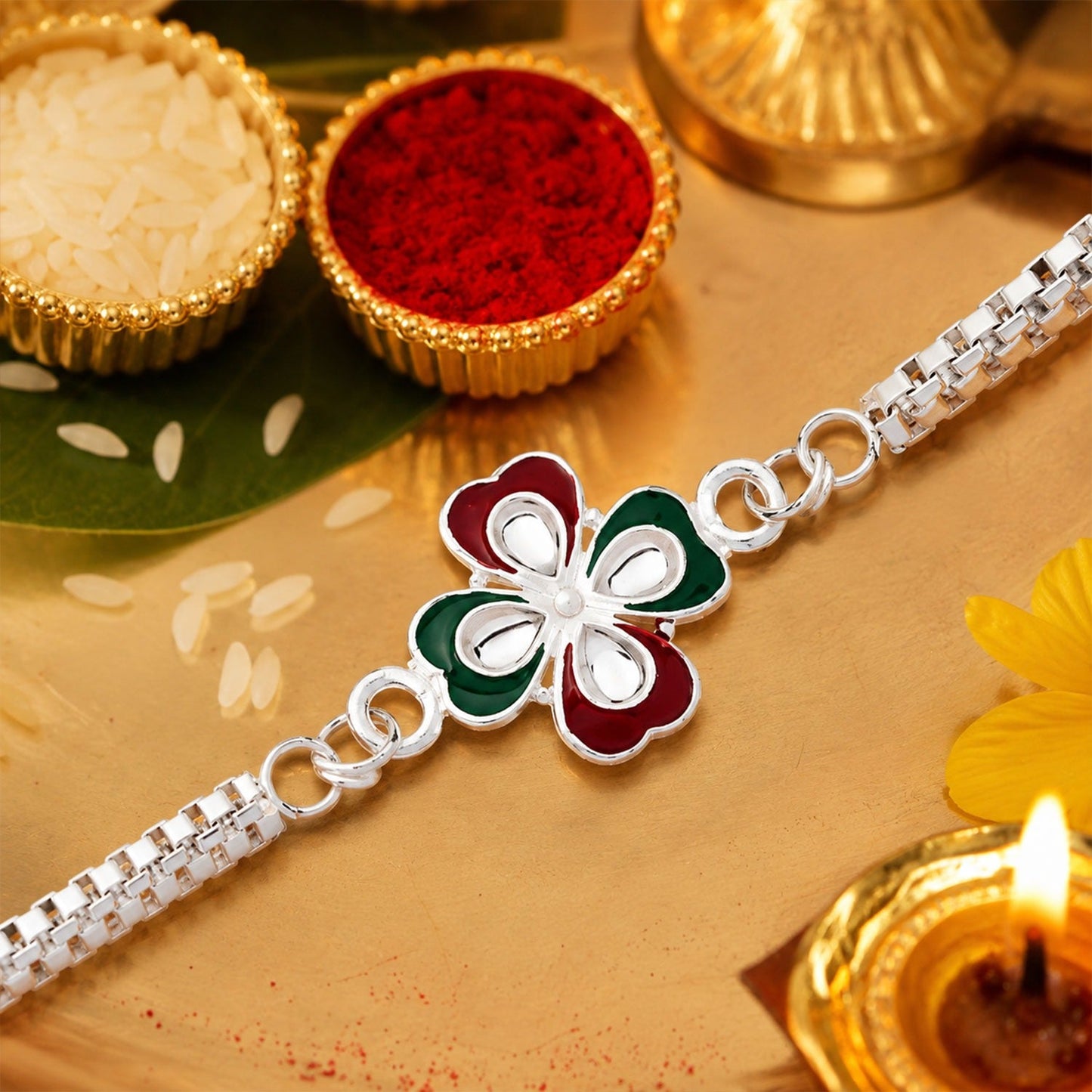 Tricolor Enamel Rakhi featuring an elegant floral design for Rakshabandhan celebrations.