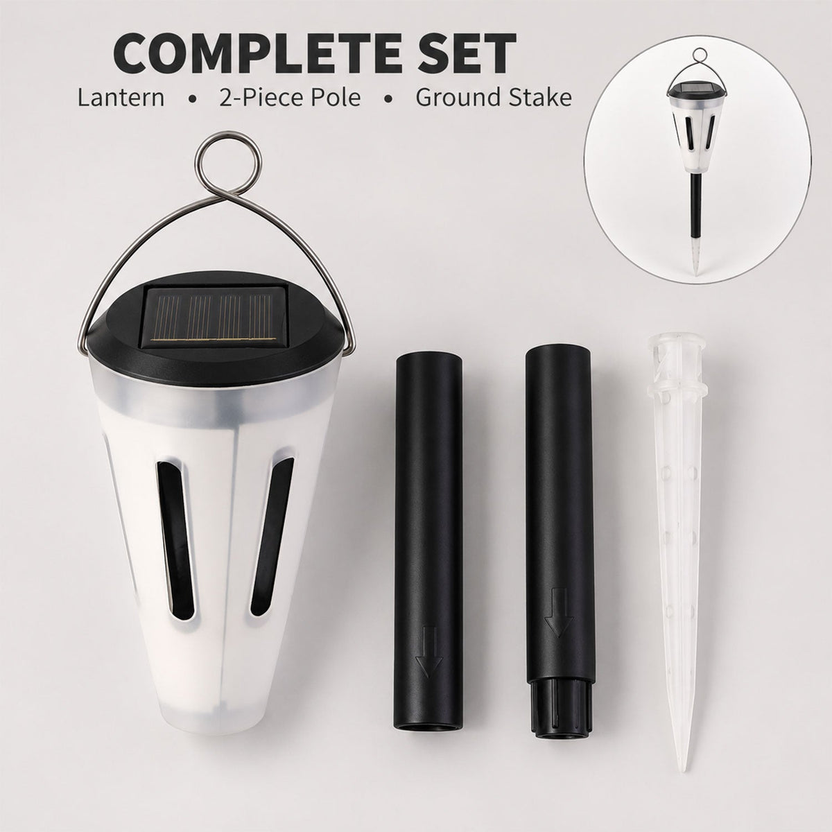 The complete set of a solar garden light, two-piece pole, and ground stake is laid out on a gray surface.
