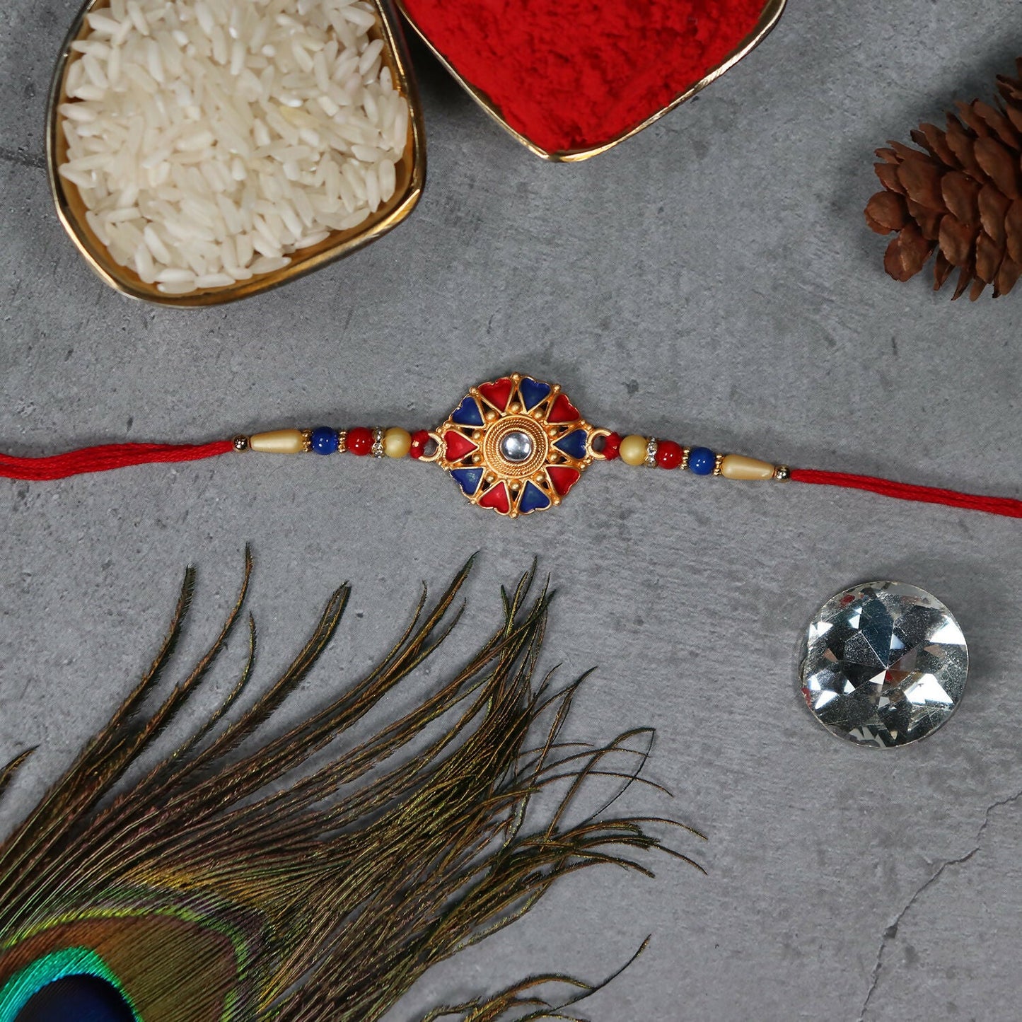 Side view of traditional Rakhi showcasing detailed craftsmanship and rich colors.