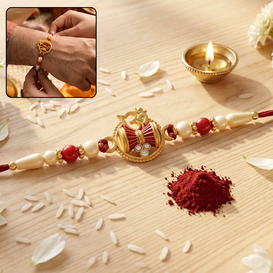 Golden Damru Om Rakhi featuring an Om symbol and decorative red and white beads.