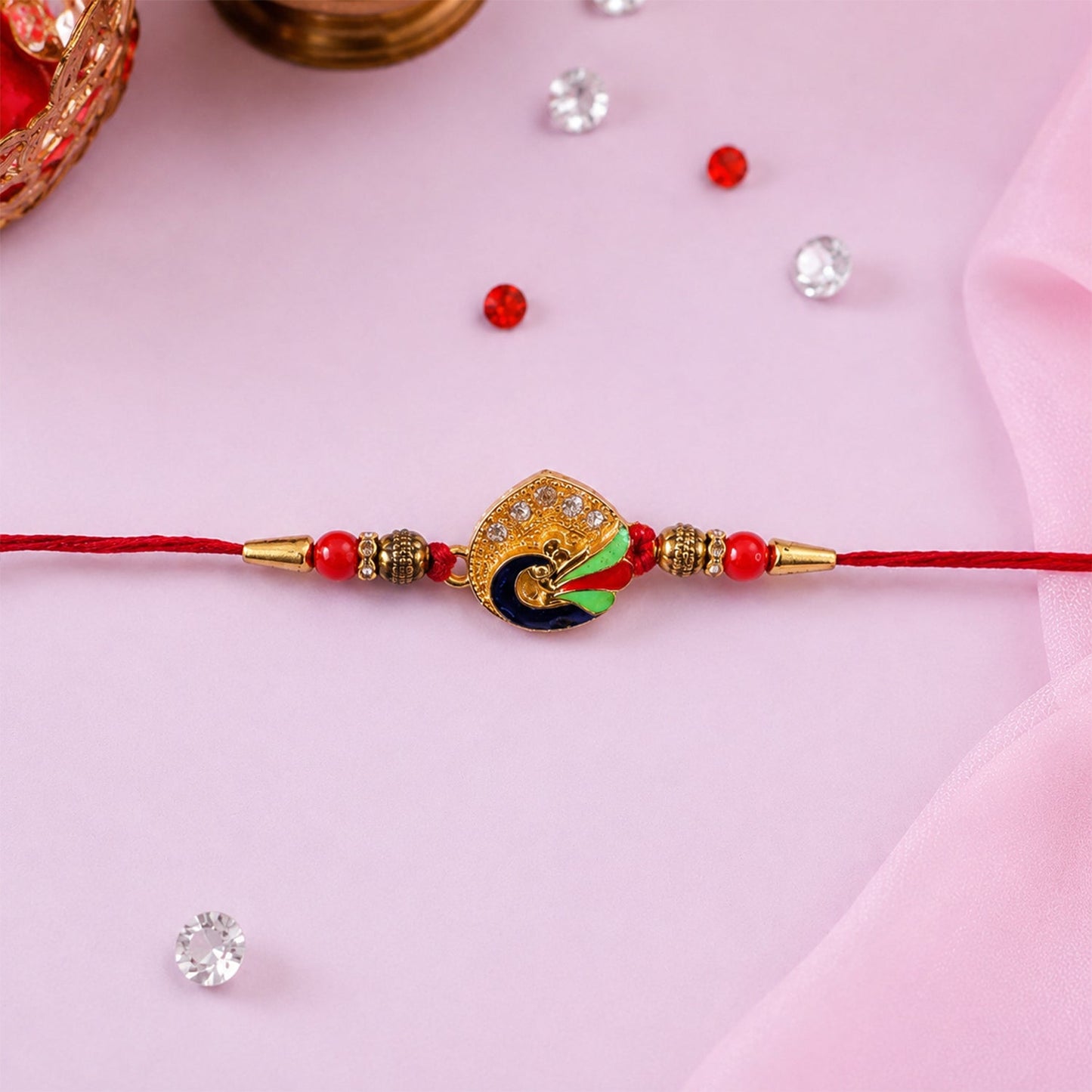Lightweight peacock feather Rakhi with stylish design for Raksha Bandhan