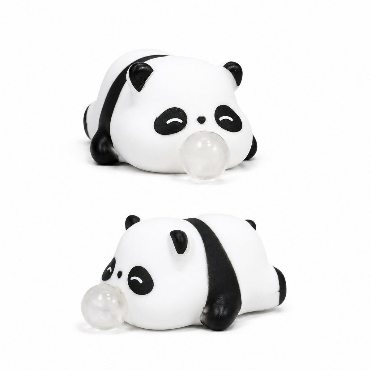Two identical white and black panda squeeze toys, each with a clear bubble from its mouth, are stacked vertically on a white