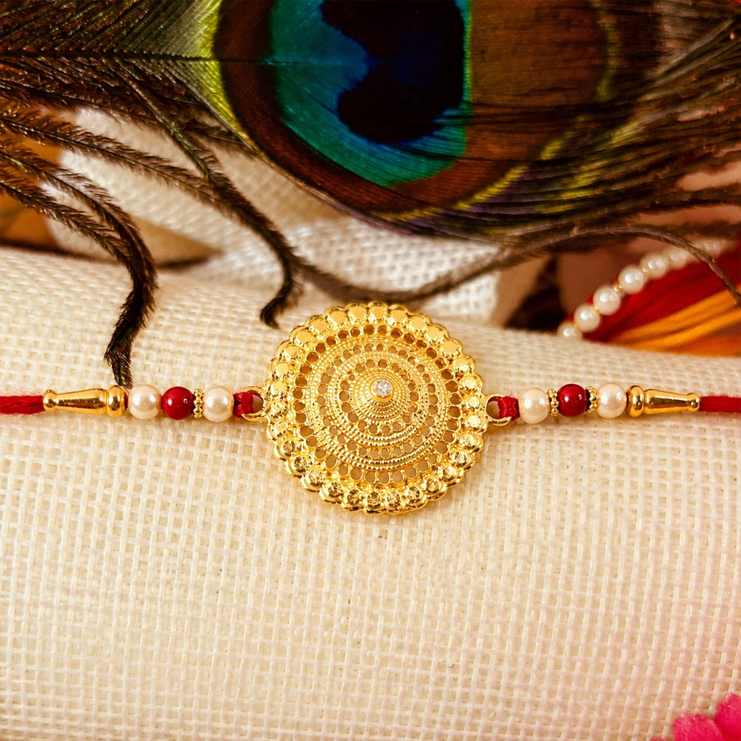 Gold and pearl Rakhi with traditional thread, perfect for Raksha Bandhan