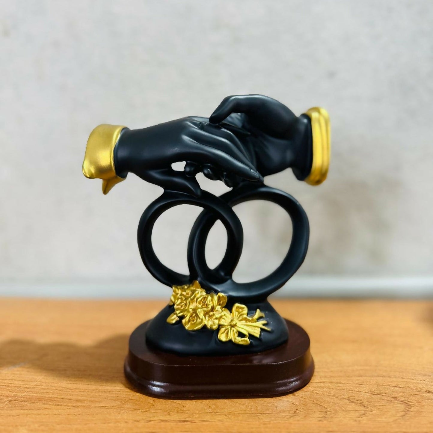 Luxury Black & Gold Handshake Figurine with Interlocked Rings & Floral Base | Romantic Couple Holding Hands Showpiece for Home DÃ©cor, Wedding Gift, Anniversary Gift, Office Desk & Living Room Decoration