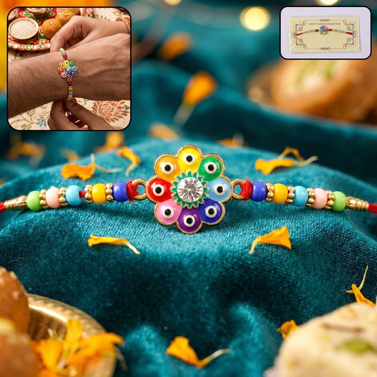 Close-up of multicolor evil eye flower design on Rakhi