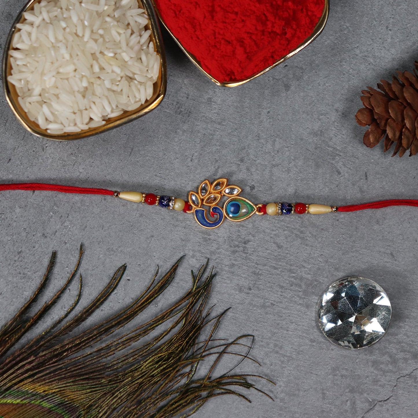Close-up of Mor Pankh Rakhi showing colorful enamel