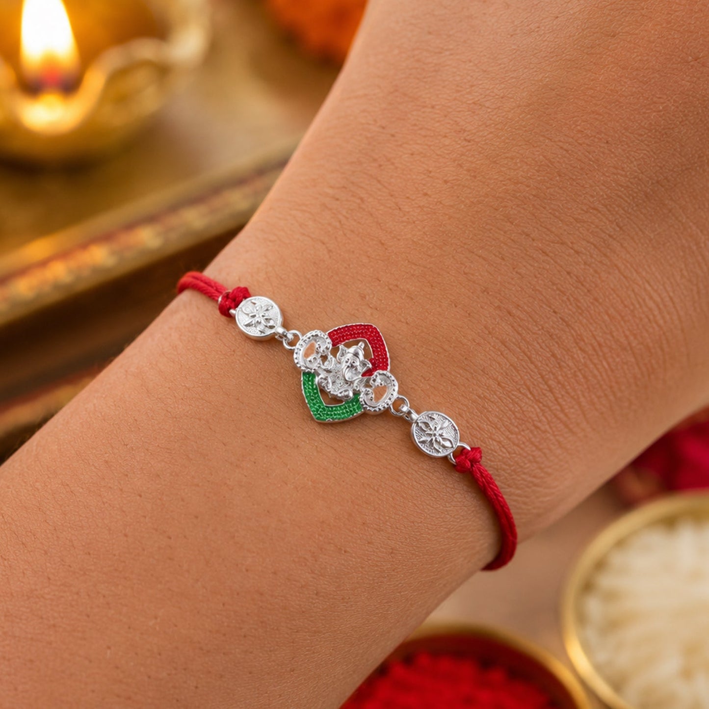 Silver Green Floral Rakhi tied on a wrist