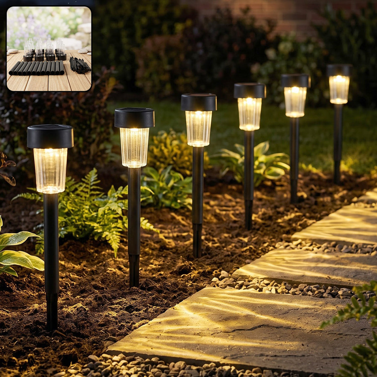 Solar pathway garden lights glowing along an outdoor walkway