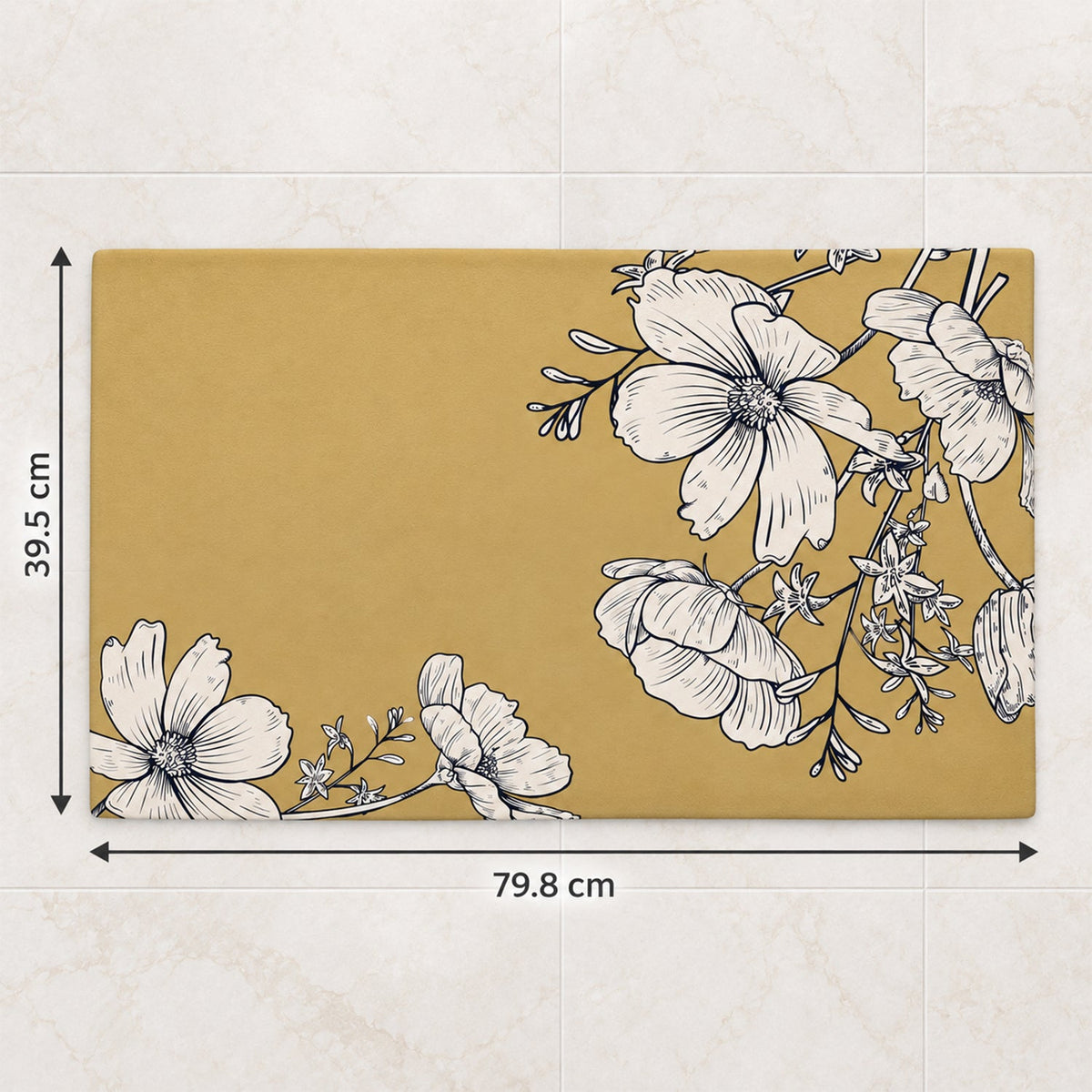 A mustard yellow mat with white floral patterns on a tiled floor, showing dimensions of 79.8 cm by 39.5 cm.