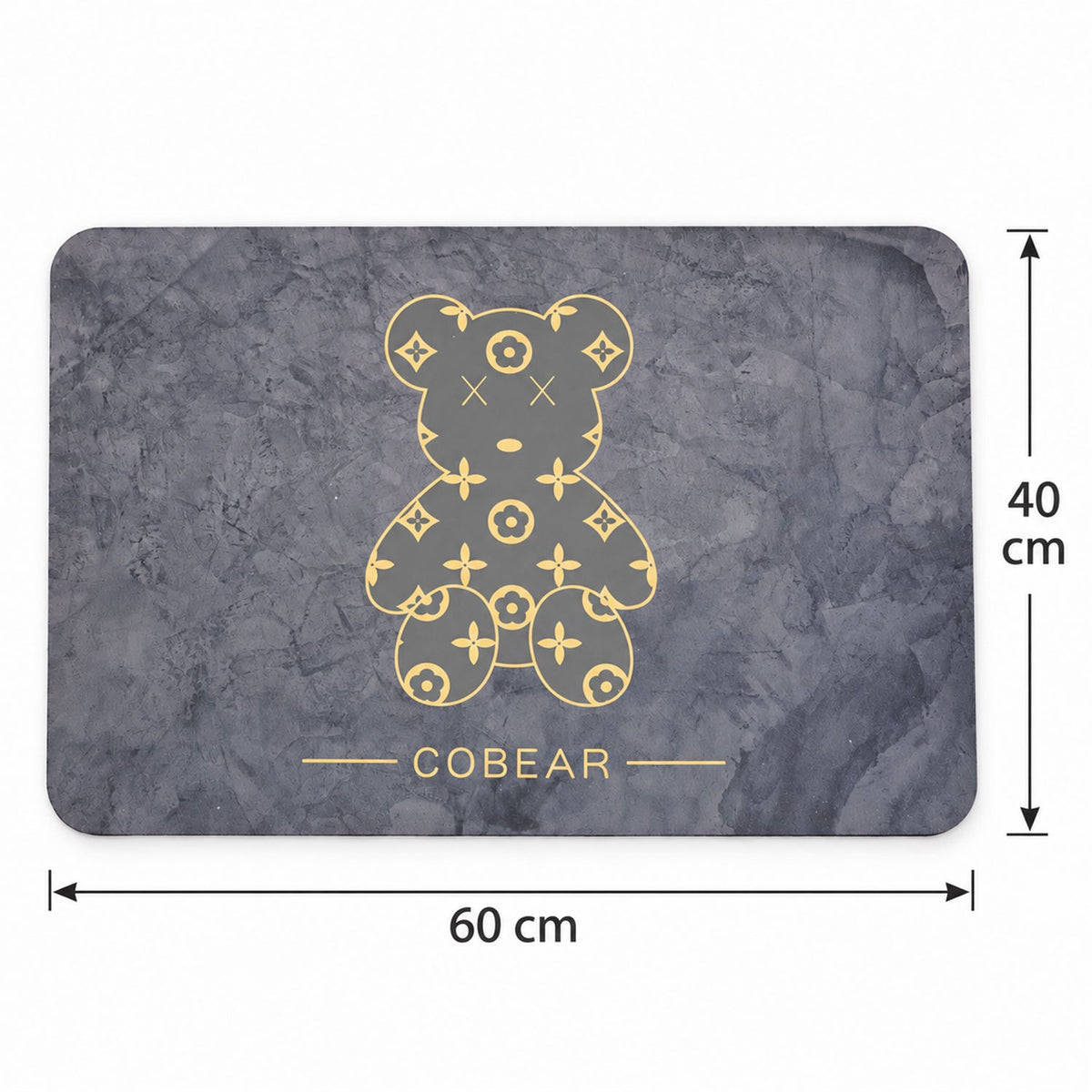 The grey bath mat with its golden bear design is shown with dimensions of 60 cm by 40 cm.