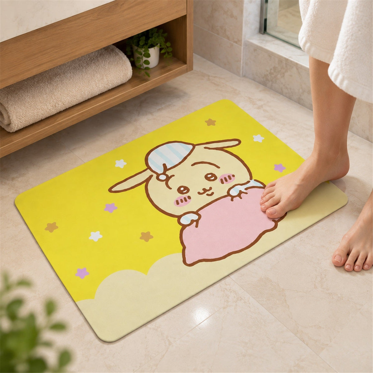 A close-up of a person's bare feet landing on the yellow bath mat with a cartoon bunny character.