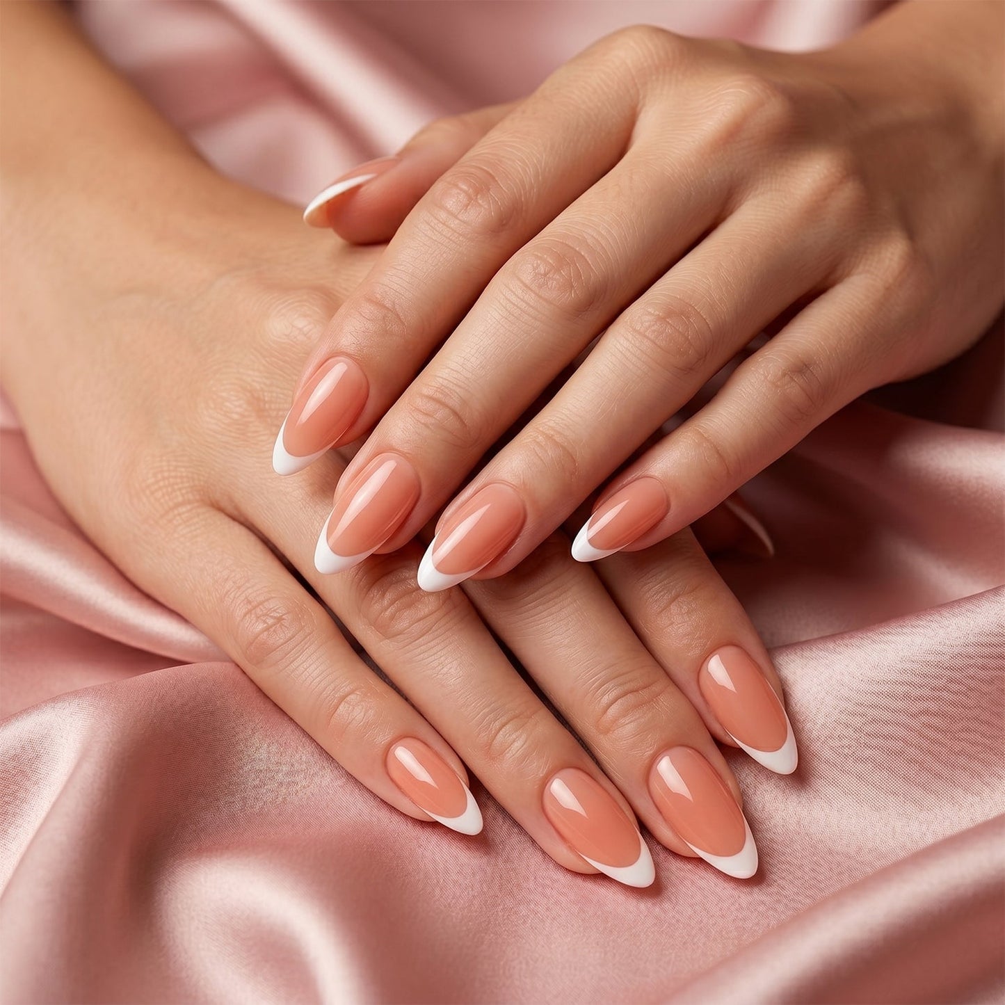 Nude pink artificial nails being shaped and painted