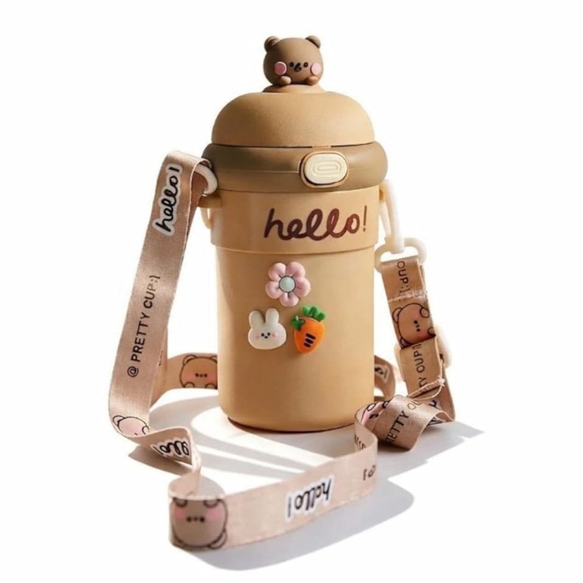A tan sipper bottle with a bear on top, 'hello!' inscription, and cute animal and flower charms, with a patterned strap.