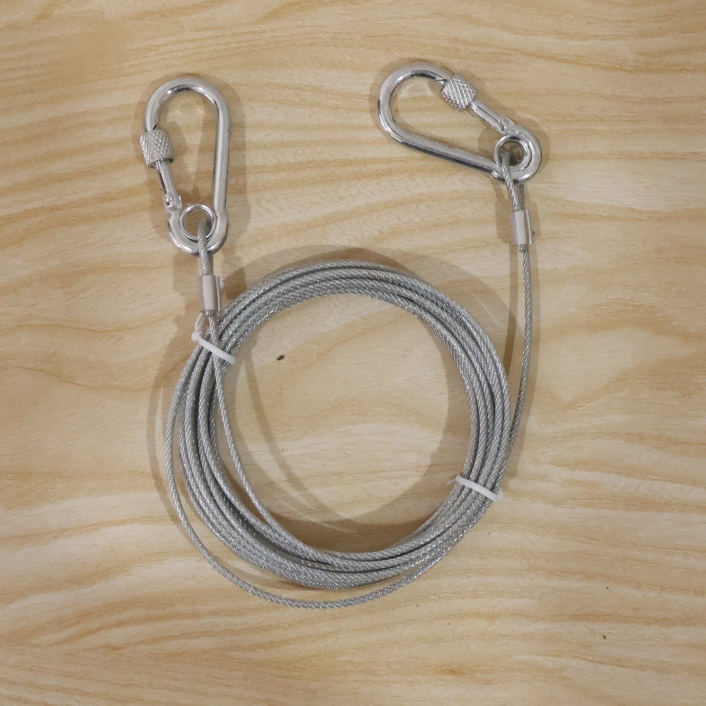 Durable stainless steel wire rope clothesline for heavy-duty drying and securing tasks.
