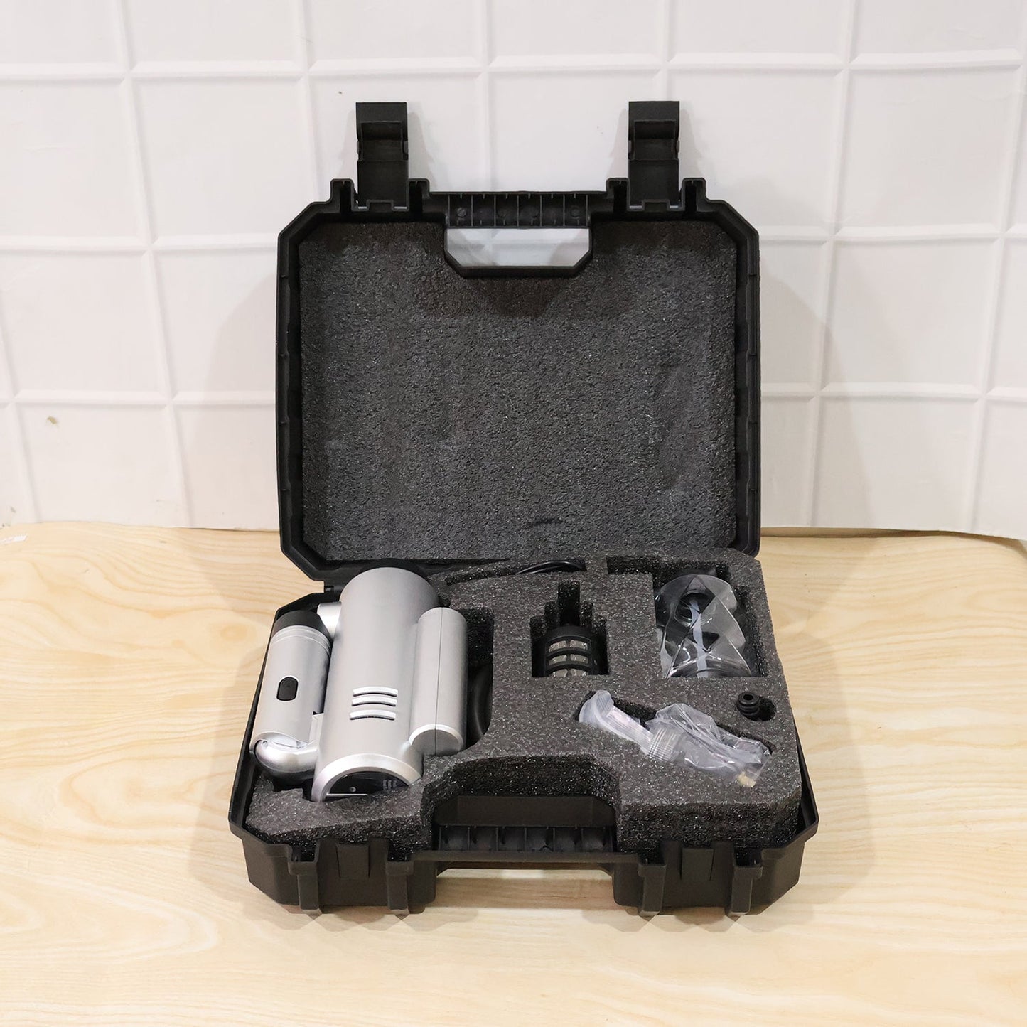 Portable high-pressure car wash gun with hose, foam bottle, and nozzles for versatile cleaning