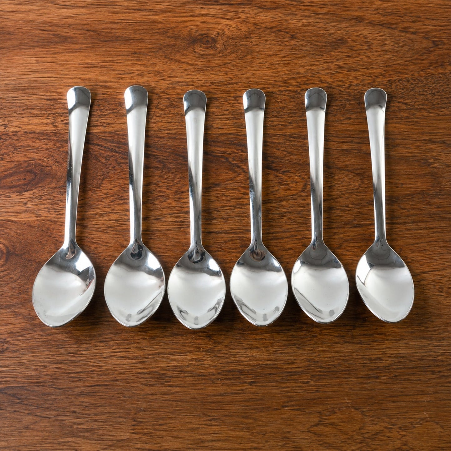 Dessert spoon serving a slice of cake