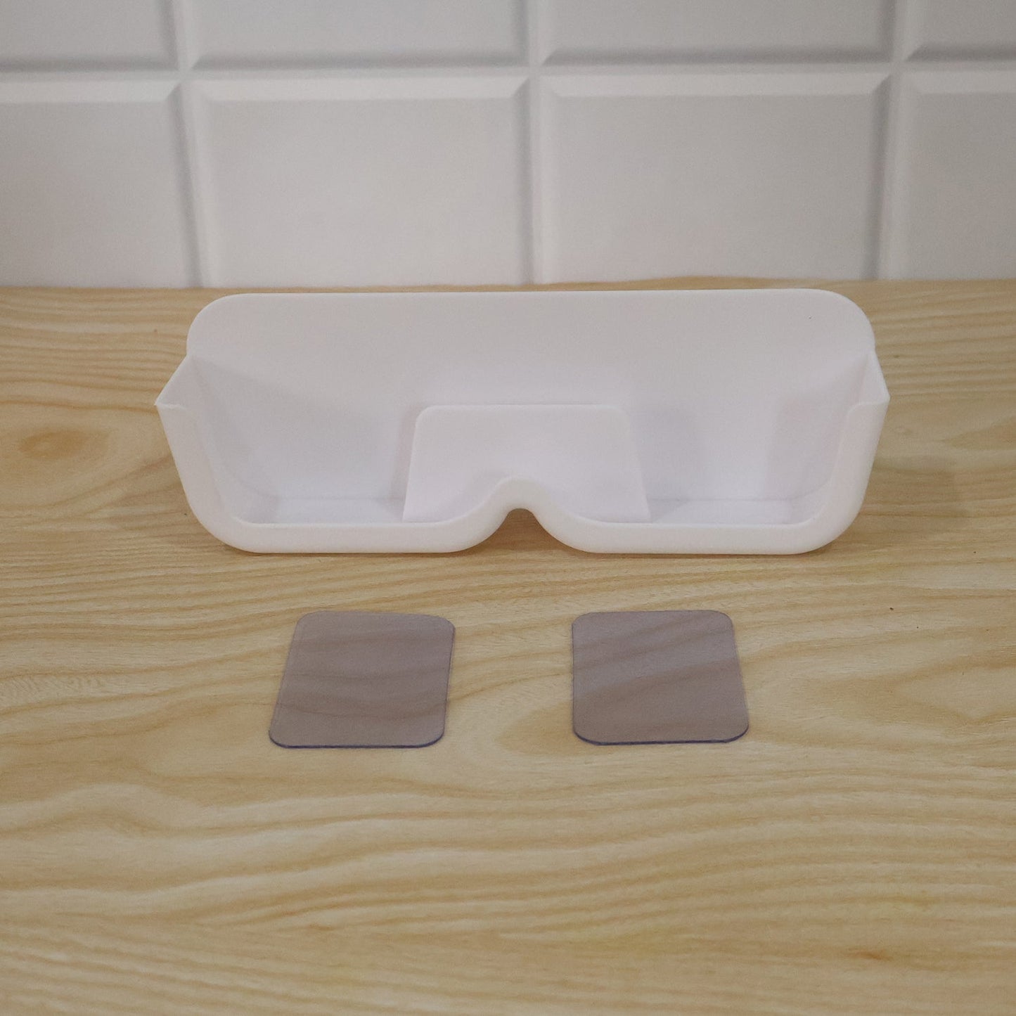 Live photo of plastic sunglasses holder stand
