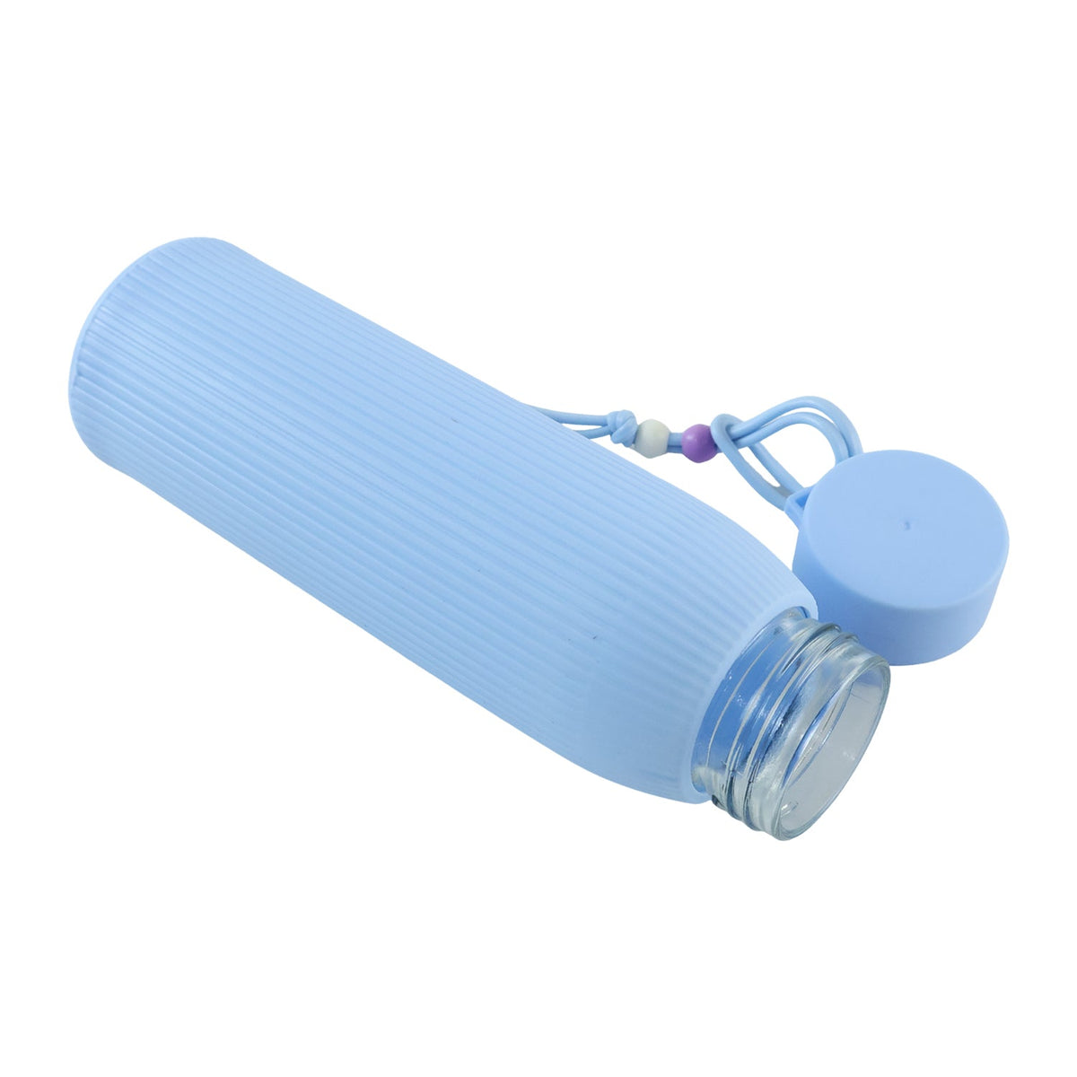 A light blue ribbed glass water bottle lies on its side with the lid removed, revealing the clear glass interior.