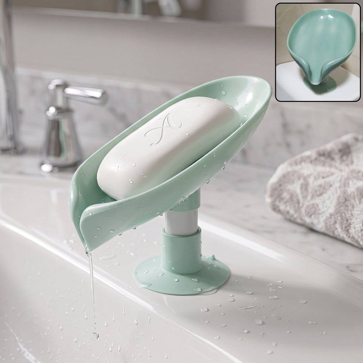 Green plastic leaf-shaped soap holder with suction cups mounted on bathroom tile