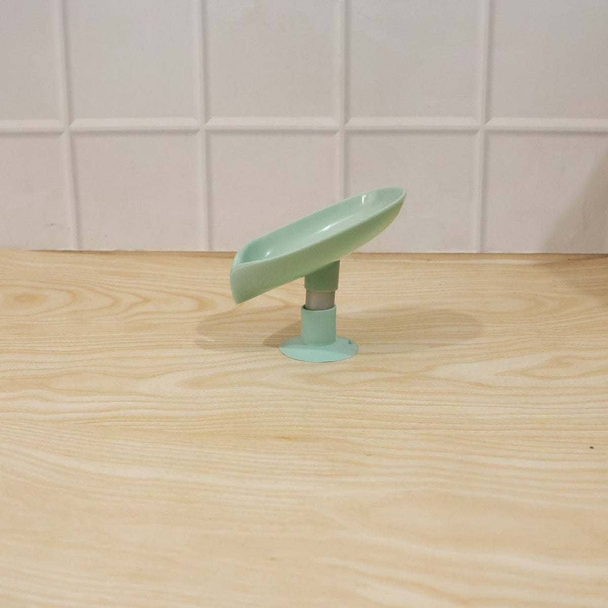 Waterproof plastic soap holder, wall mounted with suction cups in a bathroom environment