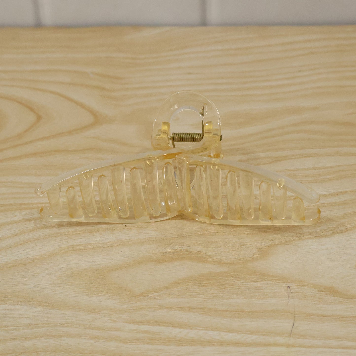 Live photo of stylish transparent hair claw clip