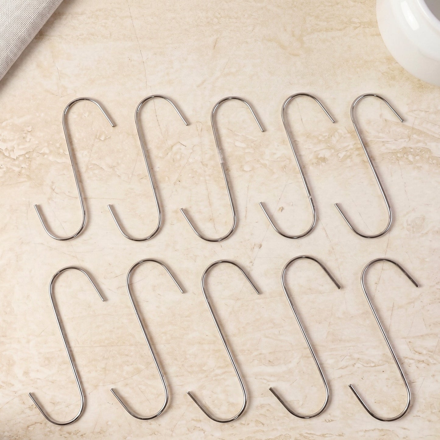 Organized kitchen using heavy-duty S-hooks for utensils and pans.