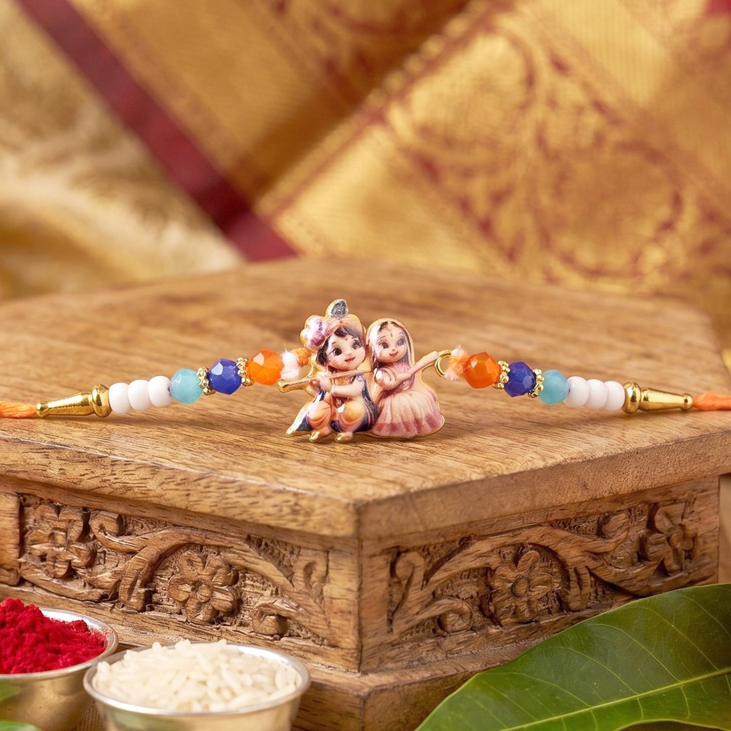 Radha Krishna designer Rakhi with colorful beadwork and divine motifs, perfect for gifting.