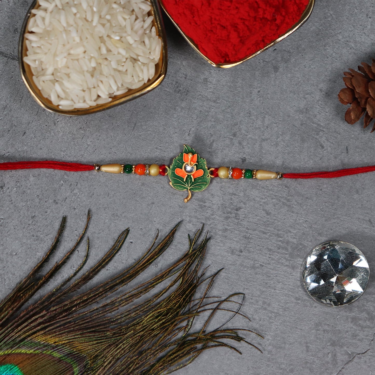 Green Tulsi Leaf Rakhi displayed on festive background