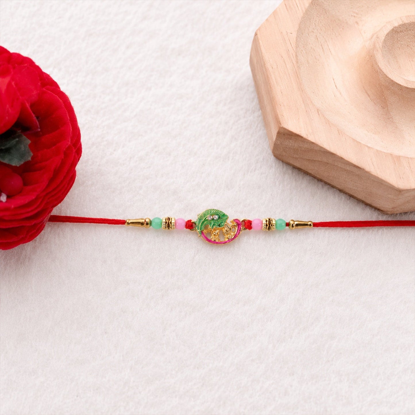 Soft thread of Mini Krishna Peacock Leaf Rakhi for comfortable wear