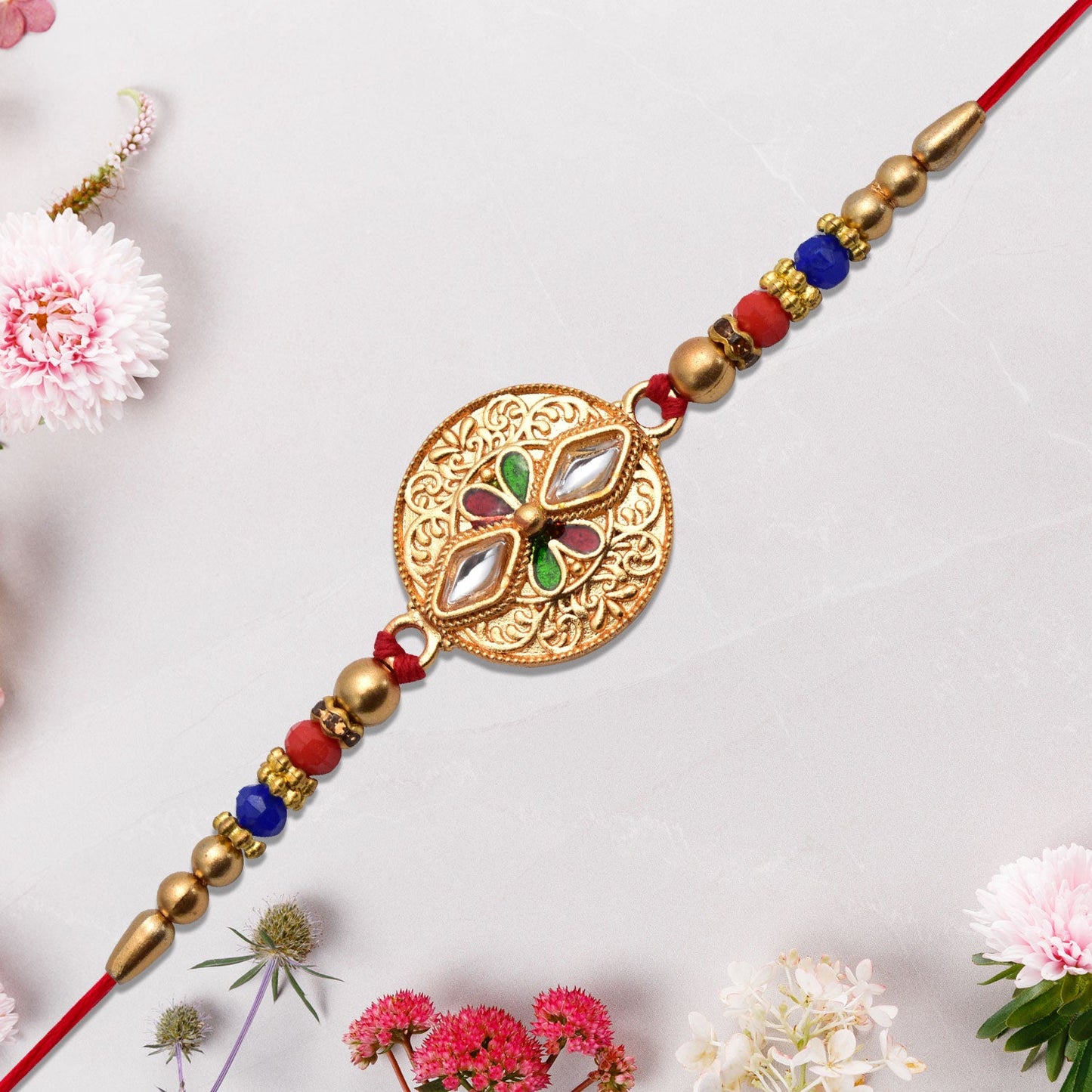Close-up of Meenakari Kundan Work Rakhi with antique finish showcasing intricate design