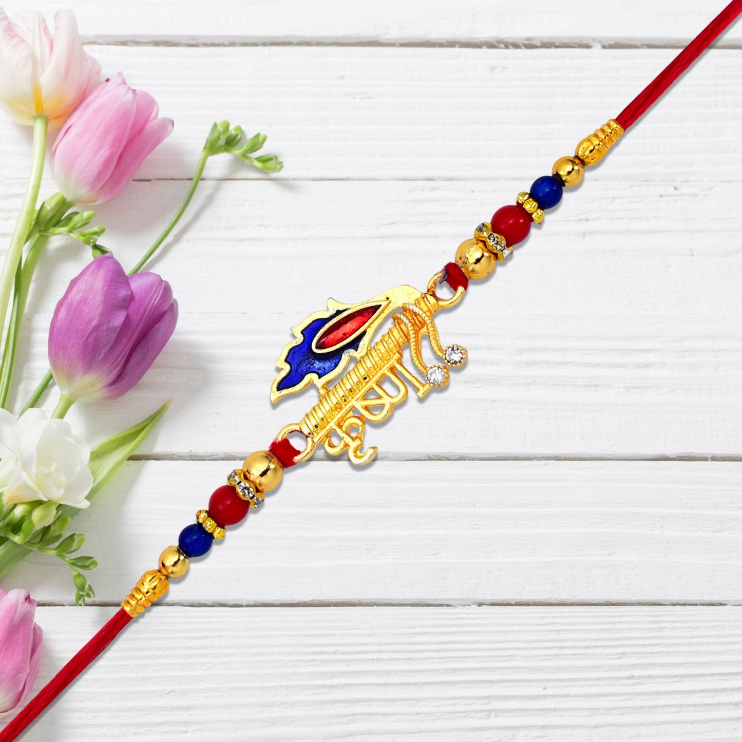 Golden Krishna Name Rakhi with intricate design for brother.