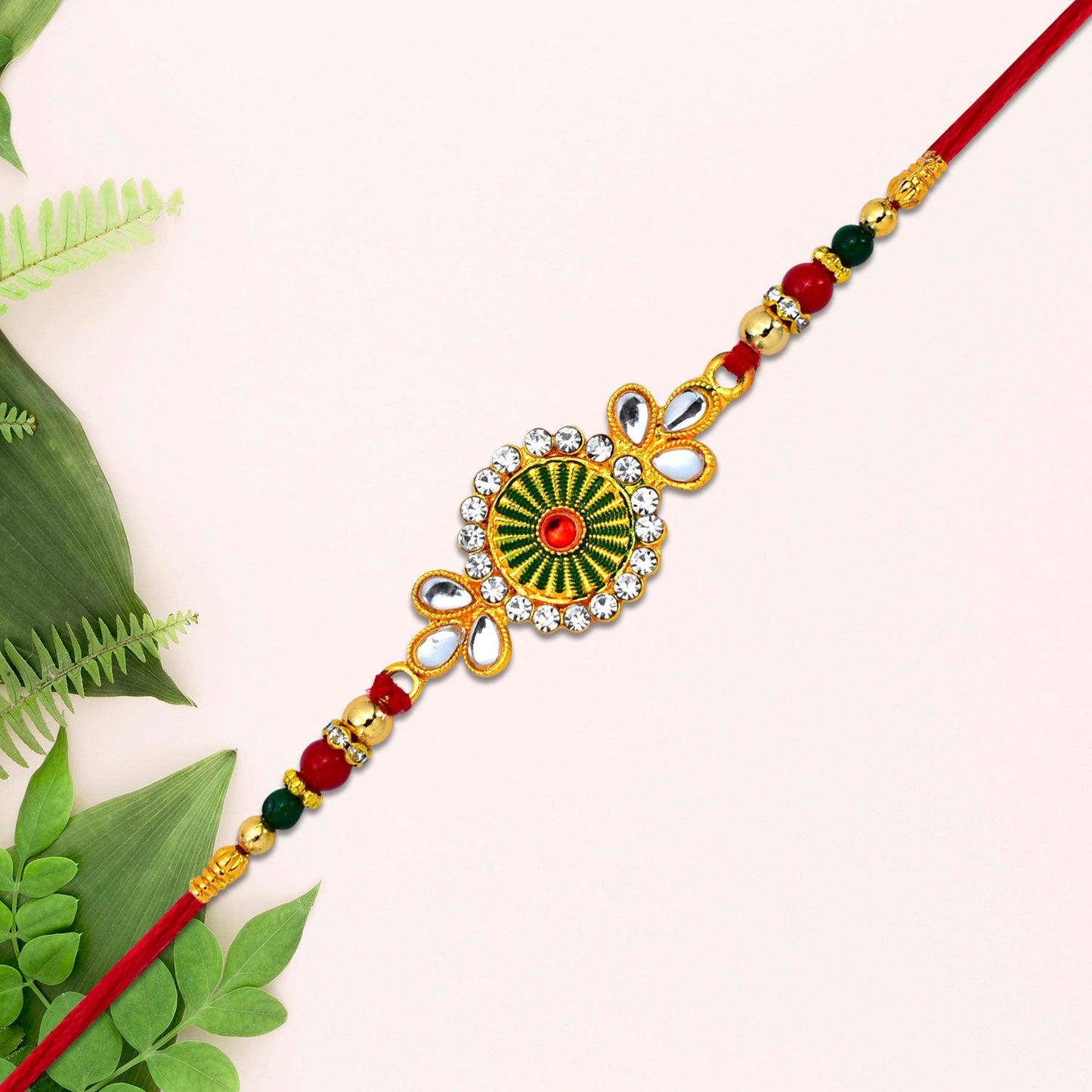 Close-up showing detailed floral elements of traditional rakhi emphasizing premium craftsmanship