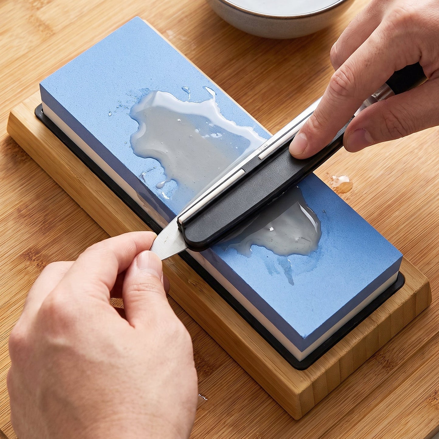 Non slip bamboo base holding the sharpening stone