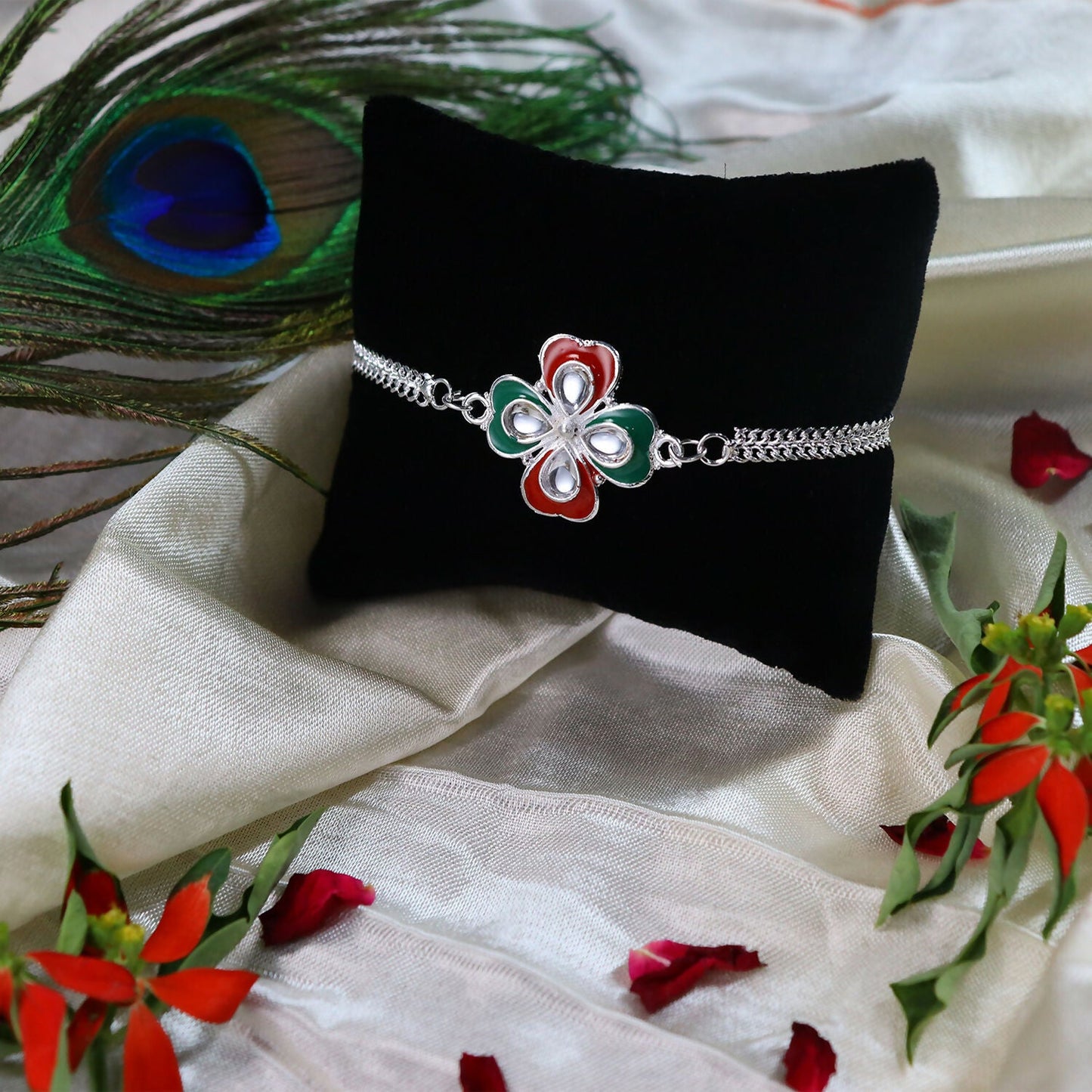Durable silver-tone metal chain detail of the Tricolor Enamel Rakhi.