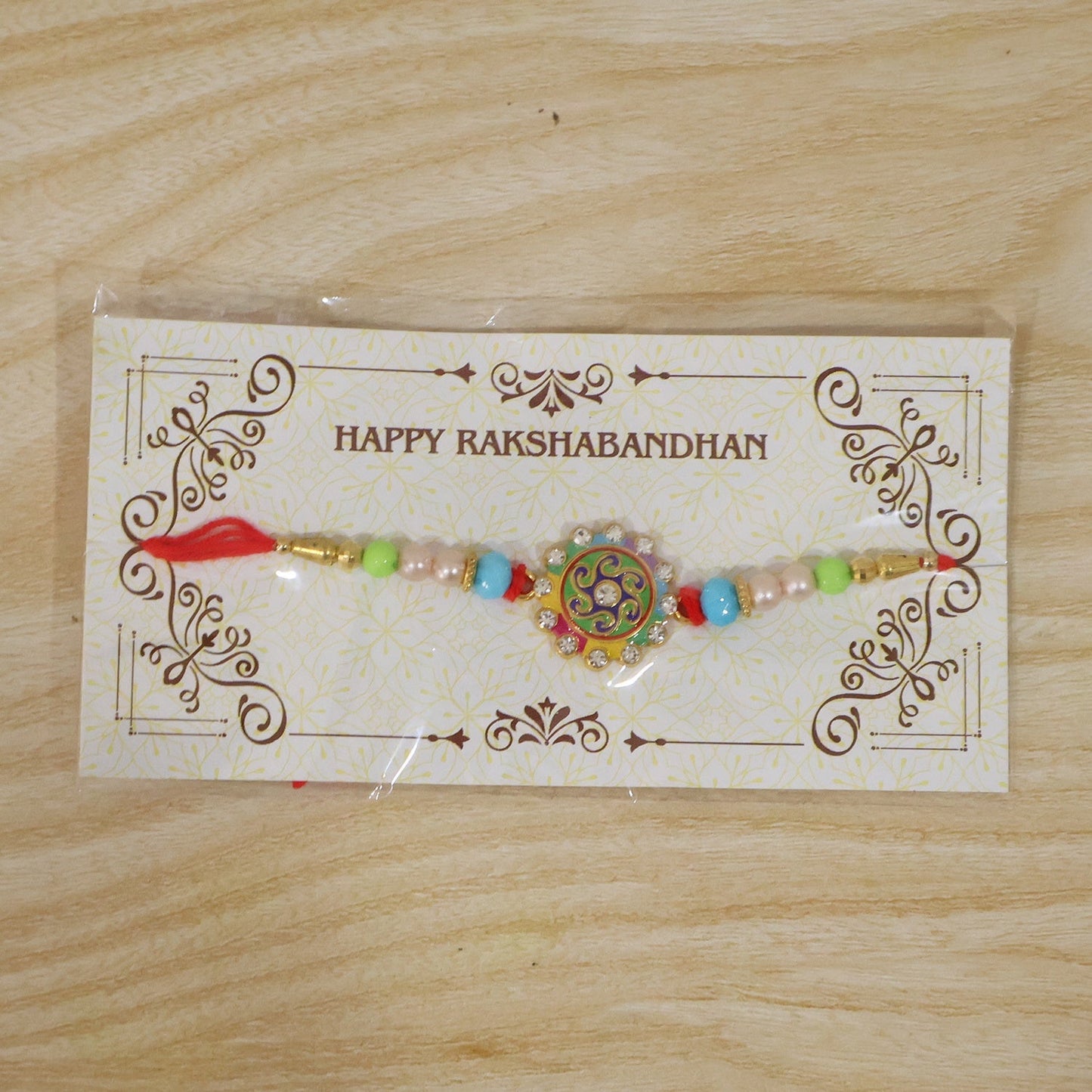 Soft thread Rakhi with floral decorations for Raksha Bandhan gifting