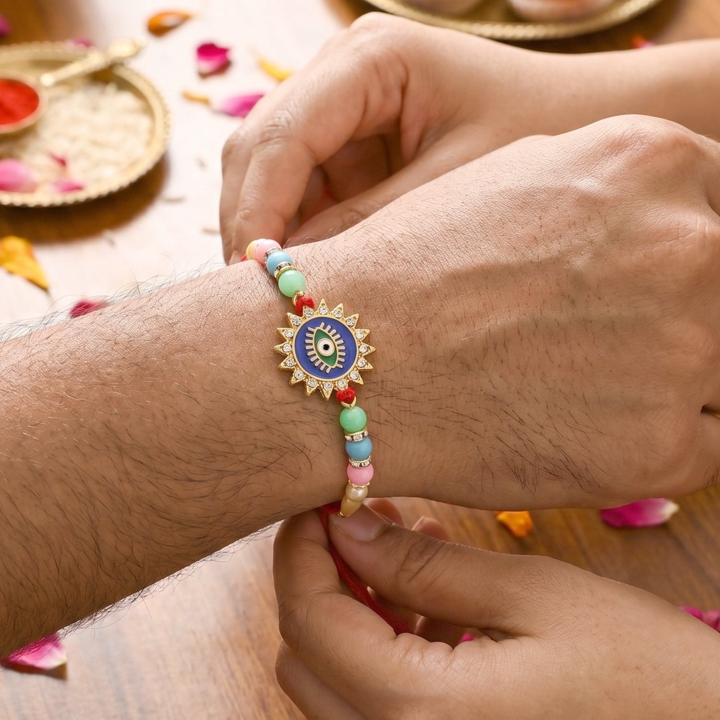 Traditional soft thread and intricate Sun Rays charm of Rakhi