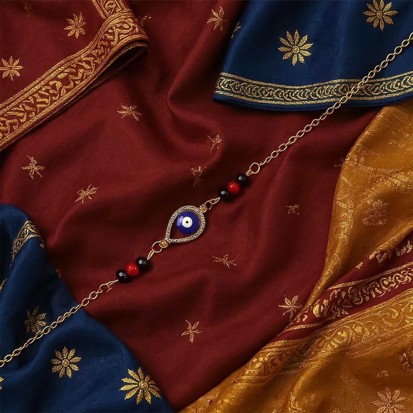Assortment of festive Golden Rakhi designs, hinting at the surprise element inside.