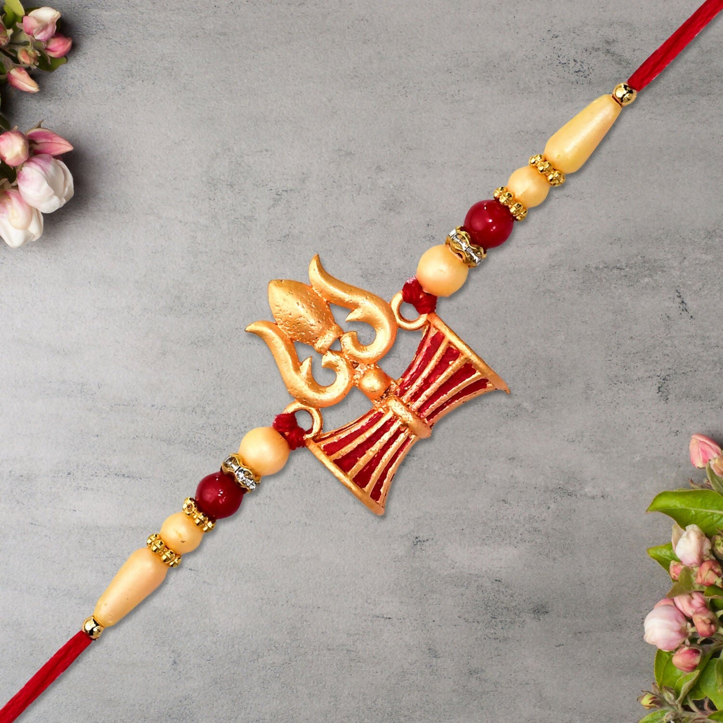 Shiva Trishul Rakhi tied on wrist illustrating comfortable fit and elegant style.